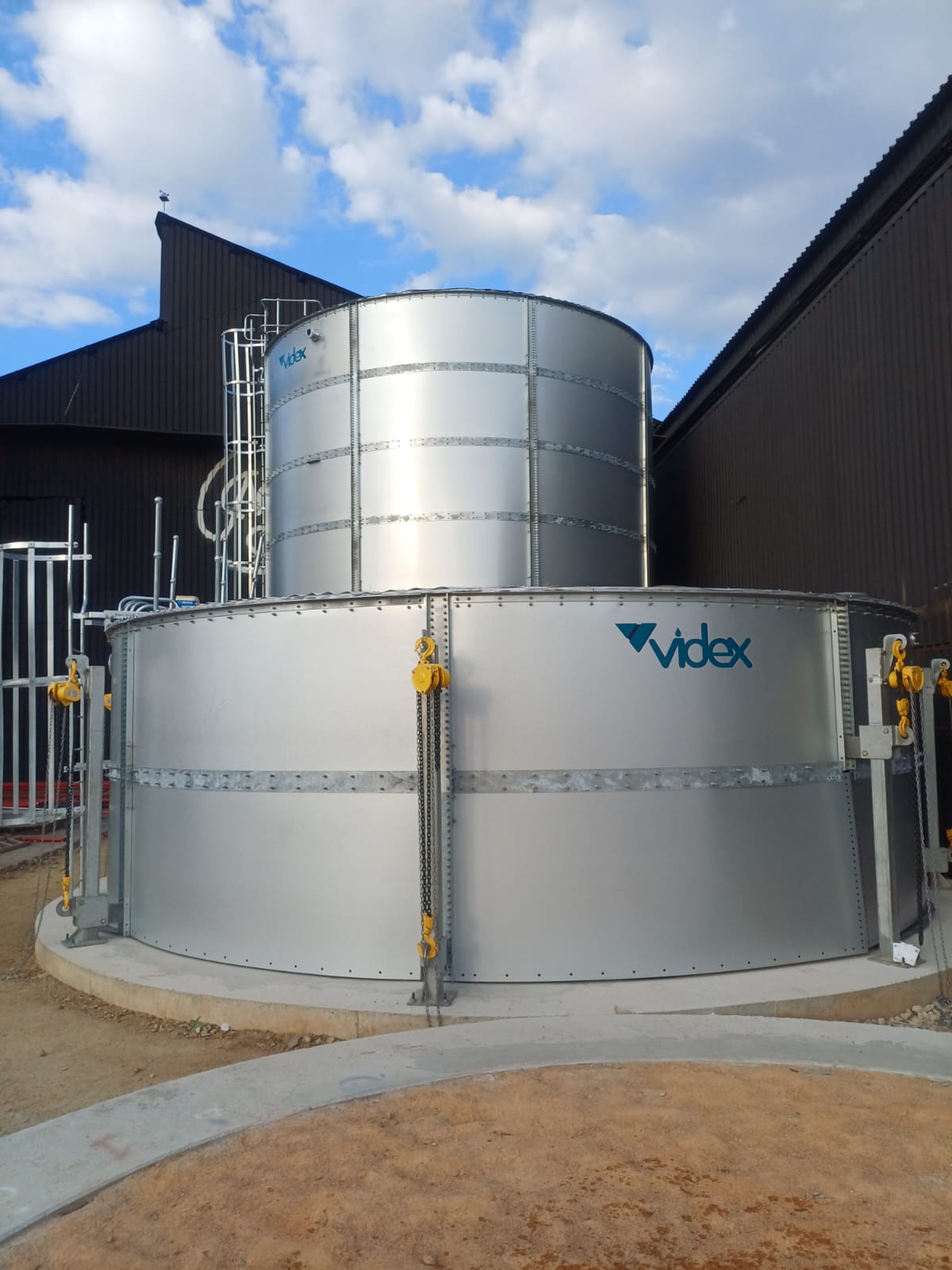 Twin cylindrical Aluzinc fire water tanks during installation at Turffontein